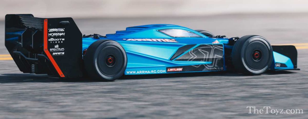 Picture of a blue Arrma limitless v2 high speed RC car on a track