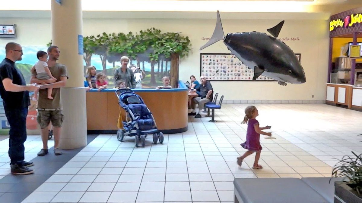 photo of a flying rc shark in a mall