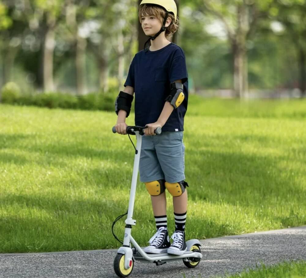 Picture of a young boy riding a Segway Ninebot ZING C10